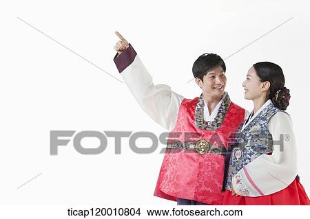 a couple facing same place wearing Hanbok View Large Photo Image Picture - a couple facing same place wearing Hanbok . Fotosearch