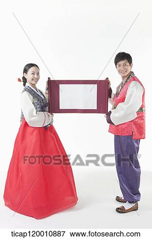 a couple in Hanbok holding Korean paper roll together View Large Photo Image Stock Photo - a couple in Hanbok holding Korean paper roll together. Fotosearch