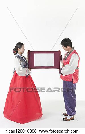 a couple in Hanbok holding Korean paper roll together View Large Photo Image Stock Photo - a couple in Hanbok holding Korean paper roll together. Fotosearch