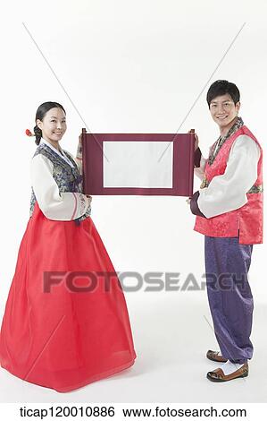 a couple in Hanbok holding Korean paper roll together View Large Photo Image Stock Photograph - a couple in Hanbok holding Korean paper roll together. Fotosearch