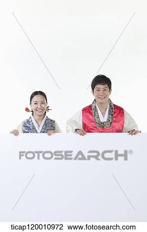 a couple in Hnabok holding an empty whiteboard View Large Photo Image Stock Image - a couple in Hnabok holding an empty whiteboard. Fotosearch