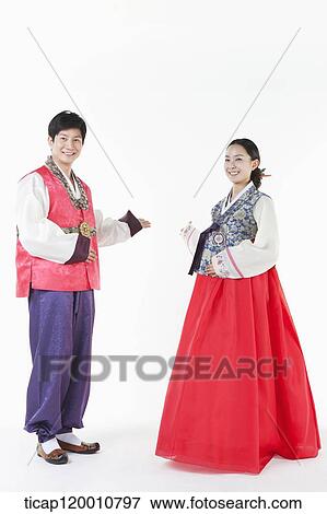 a couple introducing ways wearing Hanbok View Large Photo Image Stock Photo - a couple introducing ways wearing Hanbok . Fotosearch