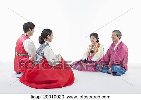a couple sitting in front of grandparents wearing Hanbok View Large Photo Image Stock Image - a couple sitting in front of grandparents wearing Hanbok. Fotosearch