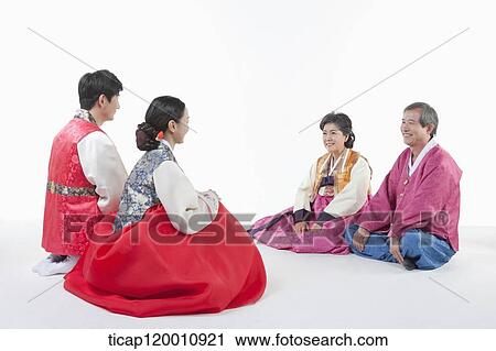 a couple sitting in front of grandparents wearing Hanbok View Large Photo Image Stock Image - a couple sitting in front of grandparents wearing Hanbok. Fotosearch