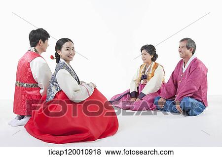 a couple sitting in front of grandparents wearing Hanbok View Large Photo Image Stock Photo - a couple sitting in front of grandparents wearing Hanbok. Fotosearch