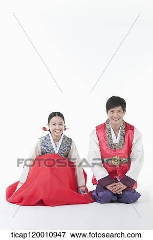 a couple sitting on the floor in Hanbok View Large Photo Image Stock Photo - a couple sitting on the floor in Hanbok. Fotosearch