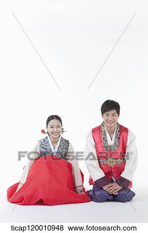 a couple sitting on the floor in Hanbok View Large Photo Image Stock Photo - a couple sitting on the floor in Hanbok. Fotosearch