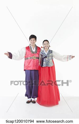 a couple spreading arms wearing Hanbok View Large Photo Image Picture - a couple spreading arms wearing Hanbok . Fotosearch