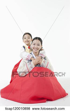 a daughter hugging mother from behind in Hanbok View Large Photo Image Stock Photo - a daughter hugging mother from behind in Hanbok. Fotosearch