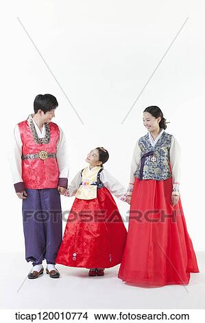a family looking at each other wearing Hanbok View Large Photo Image Picture - a family looking at each other wearing Hanbok. Fotosearch