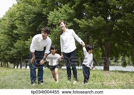 a family on grass View Large Photo Image Stock Photography - a family on grass. Fotosearch