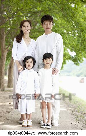 Stock Photography - a family posing standing on a trail . Fotosearch