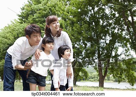 Stock Image - a family with kids posing. Fotosearch
