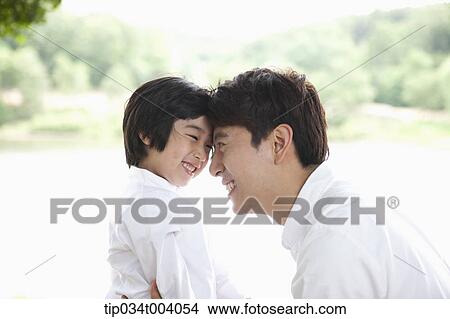 a father and a son head to head View Large Photo Image Picture - a father and a son head to head . Fotosearch
