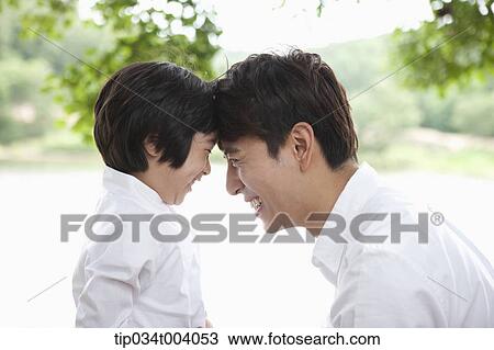 a father and a son head to head View Large Photo Image Stock Image - a father and a son head to head . Fotosearch
