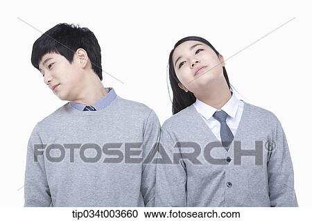 a female and male students stretching their necks View Large Photo Image Stock Image - a female and male students stretching their necks. Fotosearch
