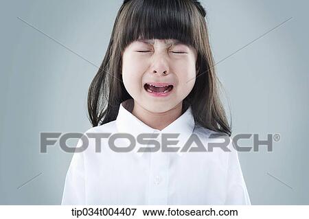a female kid in white shirts crying View Large Photo Image Stock Photo - a female kid in white shirts crying . Fotosearch