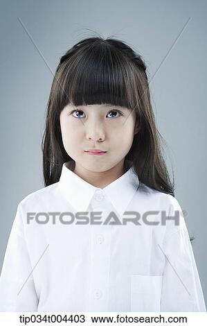 Stock Image - a female kid with white shirts . Fotosearch