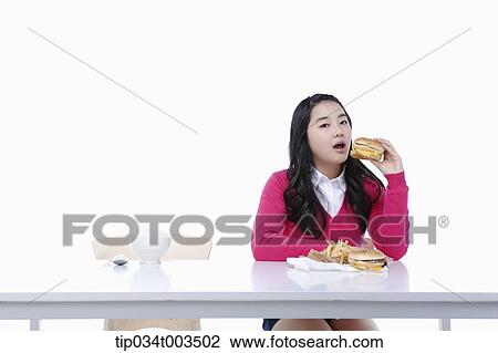 a female student in red sweater having a burger View Large Photo Image Stock Image - a female student in red sweater having a burger. Fotosearch