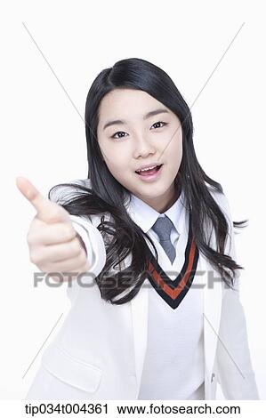 a female student in school uniform wearing a white jacket showing thumbs up towards camera View Large Photo Image Stock Image - a female student in school uniform wearing a white jacket showing thumbs up towards camera. Fotosearch