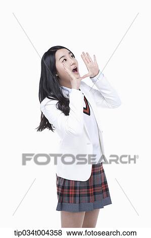 a female student in school uniform wearing a white jacket with shouting pose View Large Photo Image Stock Photo - a female student in school uniform wearing a white jacket with shouting pose . Fotosearch