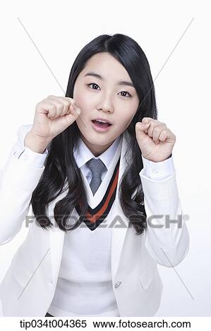 a female student in school uniform showing cute pose View Large Photo Image Stock Photography - a female student in school uniform showing cute pose . Fotosearch