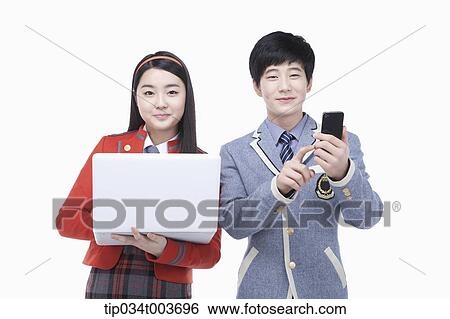 a female student smiling with laptop and male student smiling with a mobile phone View Large Photo Image Stock Photograph - a female student smiling with laptop and male student smiling with a mobile phone. Fotosearch