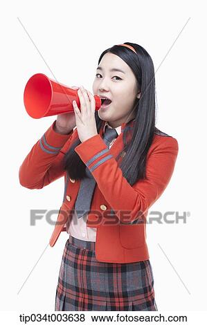 Stock Photo - a female student speaking through a red megaphone. Fotosearch