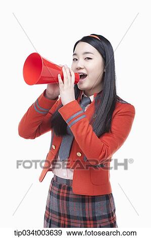 Stock Photo - a female student speaking through a red megaphone. Fotosearch