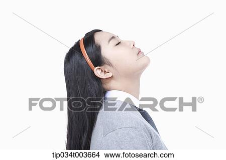 Picture - a female student stretching her neck. Fotosearch