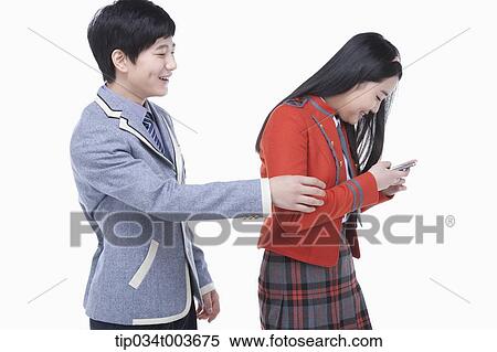 a female student taking away male student's smartphone View Large Photo Image Stock Photography - a female student taking away male student's smartphone . Fotosearch