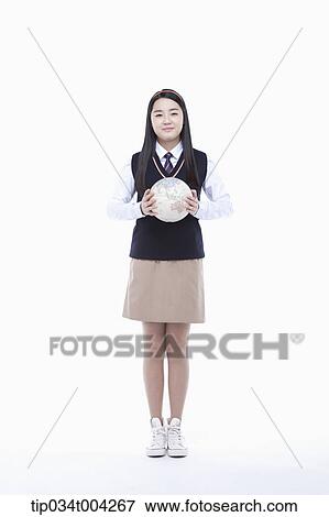 Stock Photo - a female student wearing school uniform holding a globe with two hands. Fotosearch
