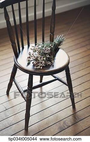 a flower bundle on a chair View Large Photo Image Picture - a flower bundle on a chair. Fotosearch