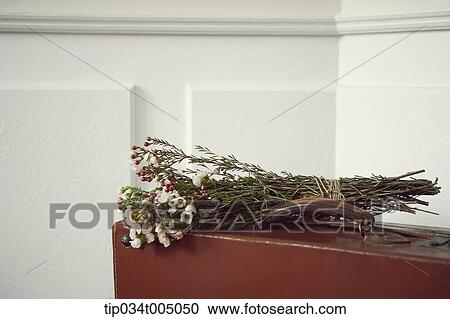 a flower bundle on brown suit case View Large Photo Image Stock Image - a flower bundle on brown suit case. Fotosearch