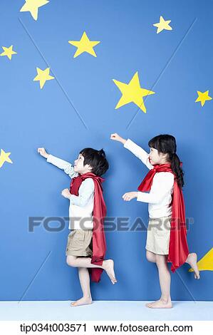 a girl and a boy posing like a superman in their side ways View Large Photo Image Stock Image - a girl and a boy posing like a superman in their side ways. Fotosearch