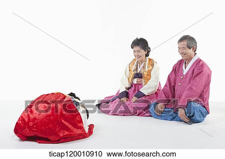 a girl bowing to grandparents wearing Hanbok View Large Photo Image Stock Image - a girl bowing to grandparents wearing Hanbok. Fotosearch