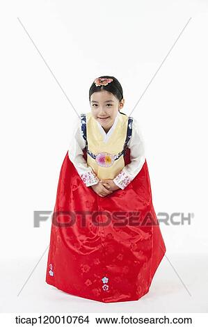 a girl bowing wearing a Hanbok dress View Large Photo Image Picture - a girl bowing wearing a Hanbok dress. Fotosearch