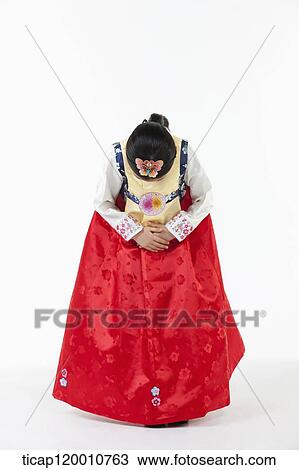 a girl bowing wearing a Hanbok dress View Large Photo Image Stock Image - a girl bowing wearing a Hanbok dress. Fotosearch