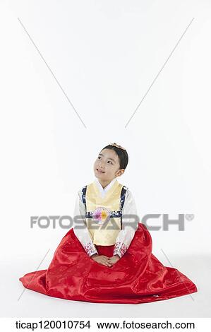 a girl looking up in the side ways wearing a Hanbok dress View Large Photo Image Picture - a girl looking up in the side ways wearing a Hanbok dress. Fotosearch
