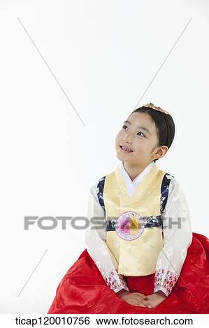 a girl looking up in the side ways wearing a Hanbok dress View Large Photo Image Stock Photograph - a girl looking up in the side ways wearing a Hanbok dress. Fotosearch