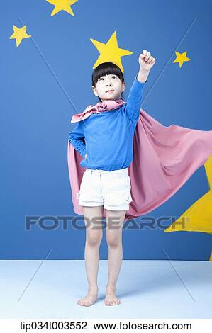 a girl posing like a superwoman with a pink cape around her neck View Large Photo Image Stock Image - a girl posing like a superwoman with a pink cape around her neck. Fotosearch