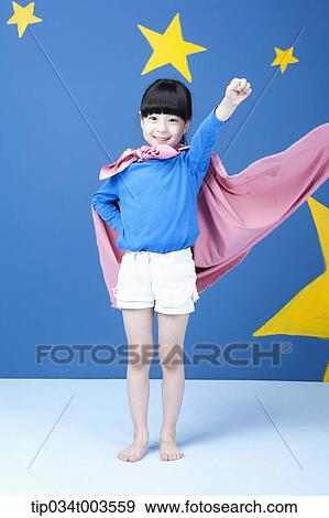 a girl posing like a superwoman with a pink cape around her neck View Large Photo Image Stock Photo - a girl posing like a superwoman with a pink cape around her neck. Fotosearch