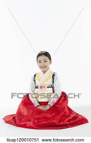 a girl sitting on a floor wearing a Hanbok dress View Large Photo Image Stock Image - a girl sitting on a floor wearing a Hanbok dress. Fotosearch