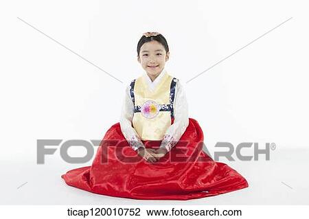 a girl sitting on a floor wearing a Hanbok dress View Large Photo Image Stock Image - a girl sitting on a floor wearing a Hanbok dress. Fotosearch