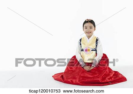 a girl sitting on a floor wearing a Hanbok dress View Large Photo Image Stock Image - a girl sitting on a floor wearing a Hanbok dress. Fotosearch