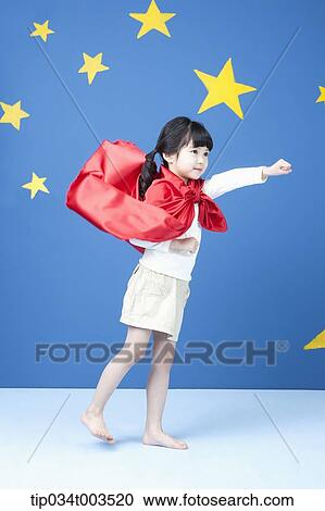 a girl spreading her arm like a superman with fluttering red cape View Large Photo Image Stock Image - a girl spreading her arm like a superman with fluttering red cape. Fotosearch