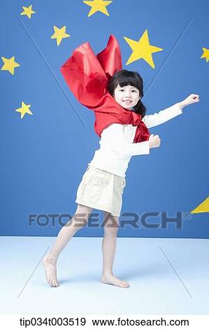 a girl spreading her arm like a superman with fluttering red cape View Large Photo Image Stock Photo - a girl spreading her arm like a superman with fluttering red cape. Fotosearch