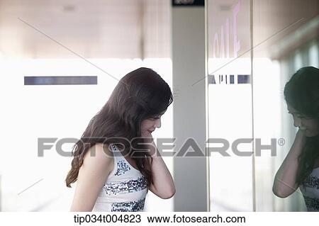 a lady looking on a show window View Large Photo Image Stock Image - a lady looking on a show window . Fotosearch