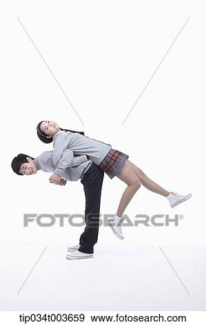 a male student carrying female student on his back View Large Photo Image Stock Photo - a male student carrying female student on his back. Fotosearch
