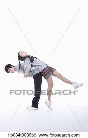 Stock Photography - a male student carrying female student on his back. Fotosearch